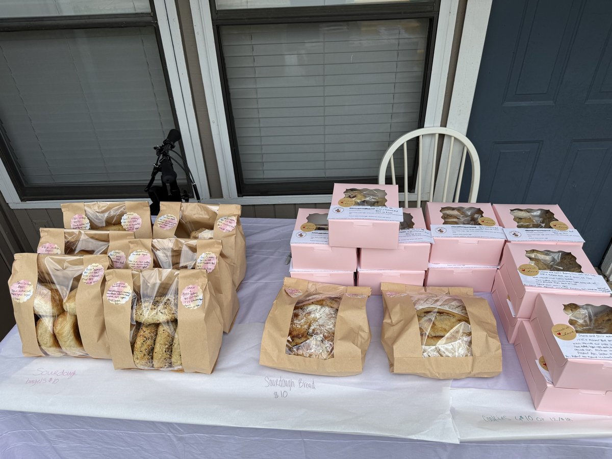 Crumb and Get It Bakery display table with packaged baked goods